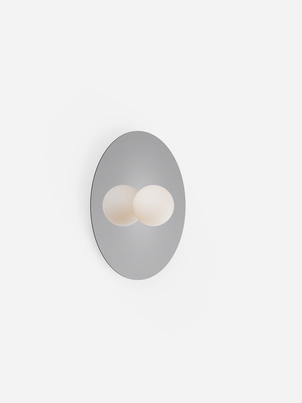 Wall-mounted light fixture with two round bulbs on a white background