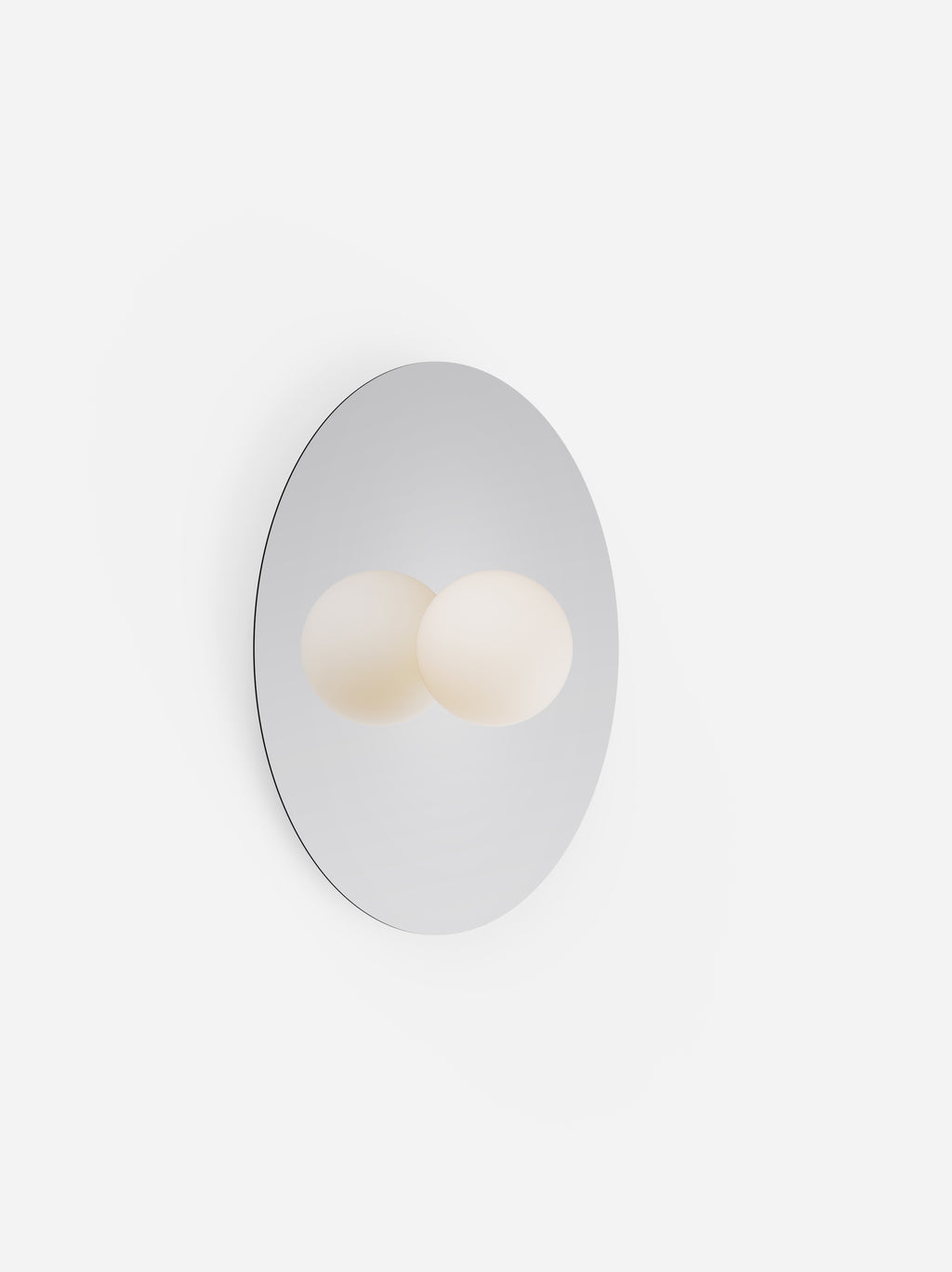 Round mirror with two light bulbs inside on a white background