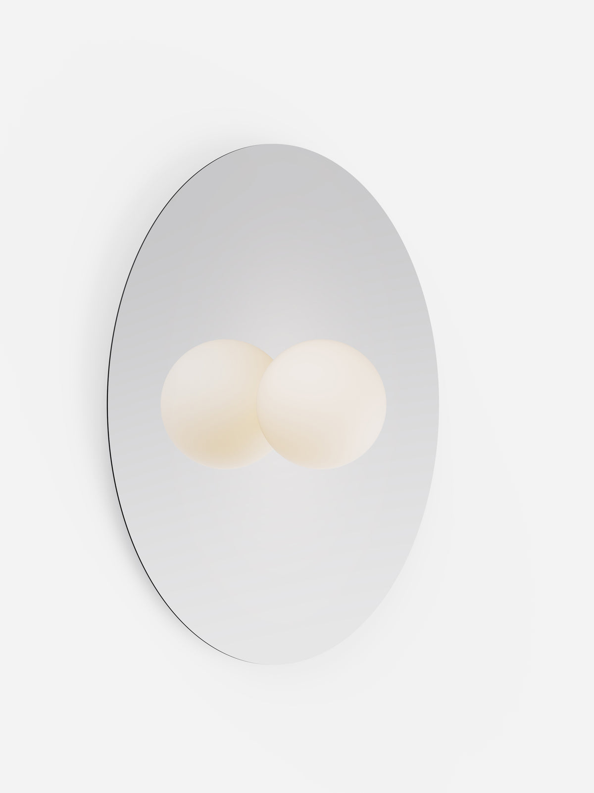 Wall-mounted light fixture with two round lights on a white background