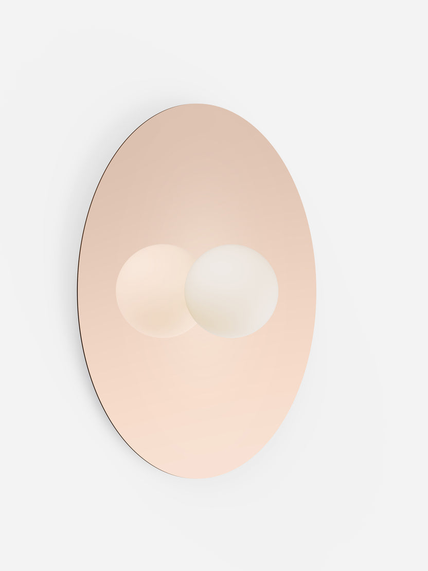 Wall-mounted light fixture with a gold finish on a white background